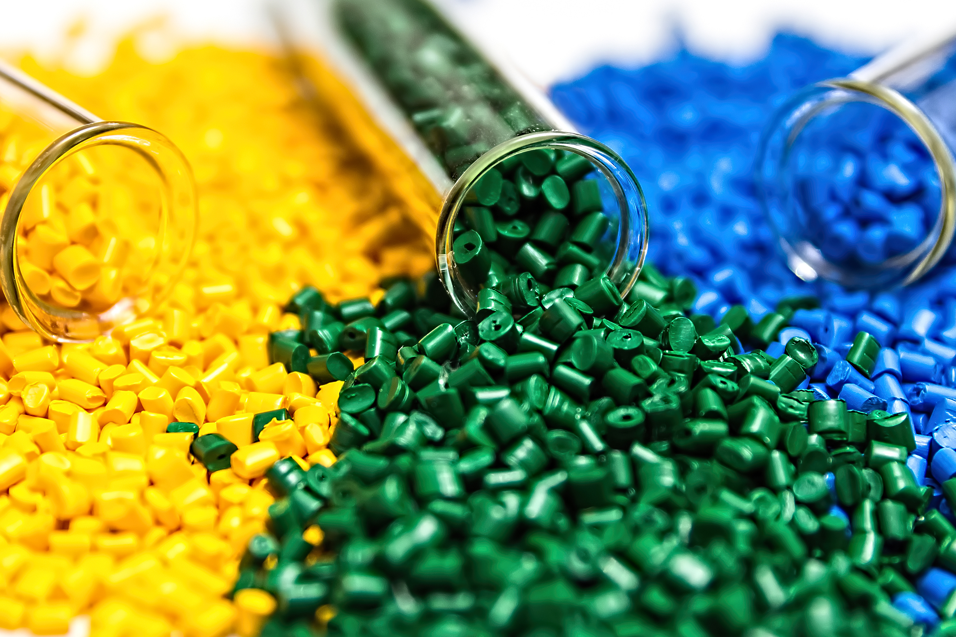 Yellow, green and blue recycled polymer pellets