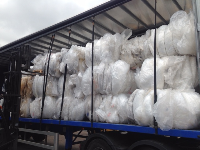 Bagged recovered materials loaded on a collection vehicle