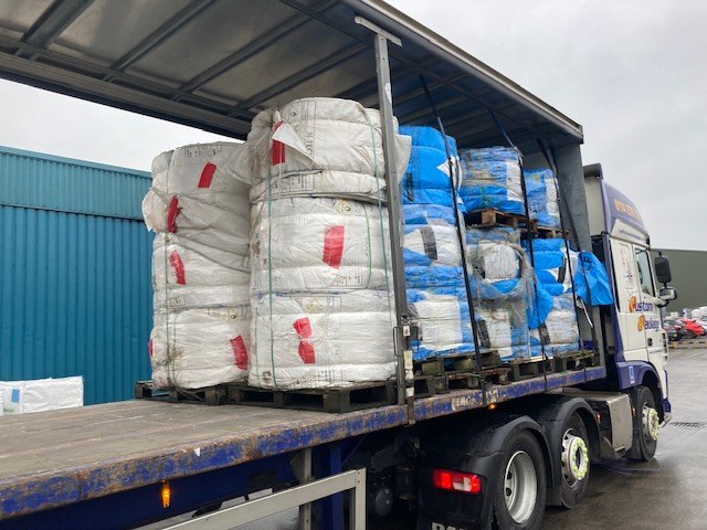 Baled materials loaded onto a collection vehicle