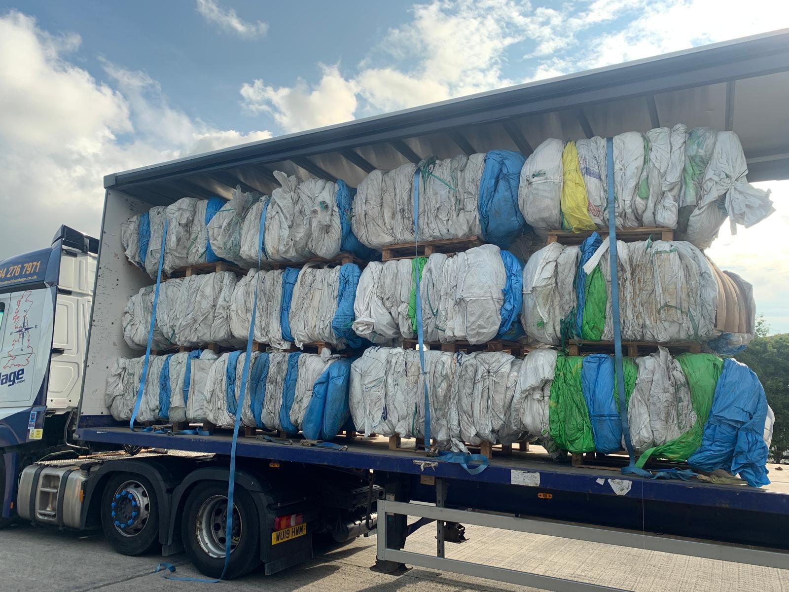 Mixed recovered material bales loaded for transportation
