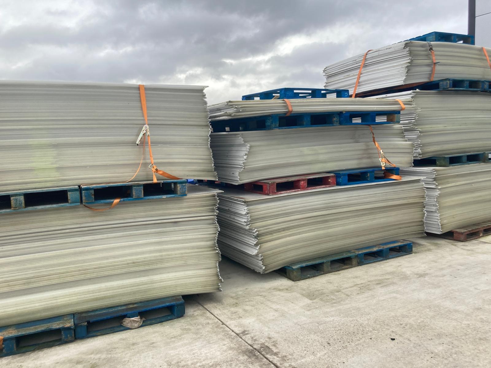 Separated sheet off-cuts stacked in storage