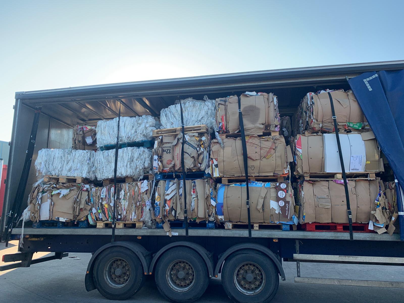 Bales secured in a trailer for delivery